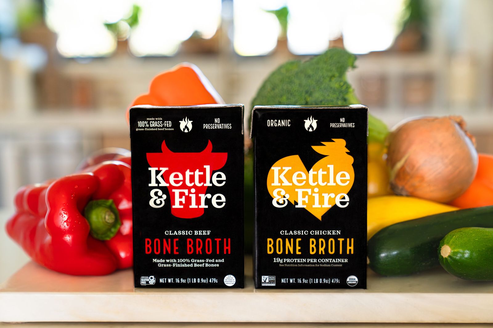 Kettle & Fire bone broth cartons with fresh vegetables