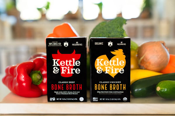 Kettle & Fire bone broth cartons with fresh vegetables